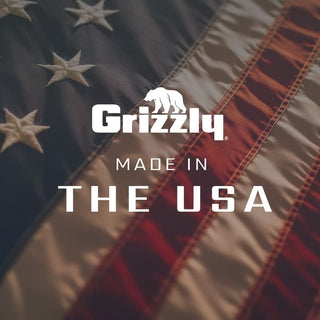 Image displaying the American flag as a background for the Grizzly Coolers logo with the words "Made in the USA" below the logo. The flag is zoomed in to where you see four stars on the blue portion of the American flag and four of the red and white stripes. Grizzly Coolers is America's cooler company.